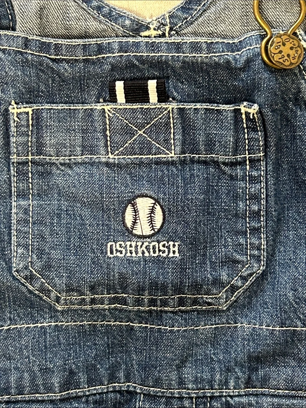 OshKosh B'gosh Dark Blue Denim Short Overalls for Kids. Embroidered baseball.
